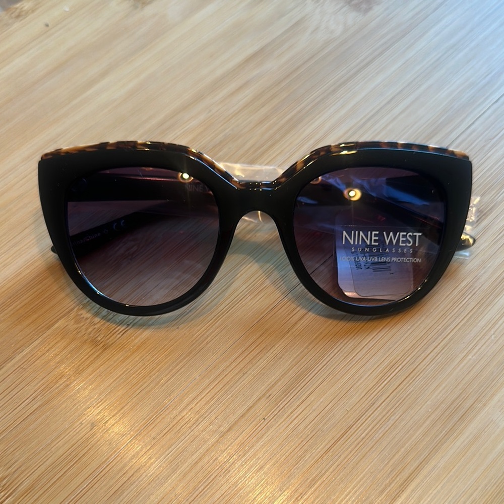 Nine West Black Oversized Cat-Eye Sunglasses with Leopard Detail on the Bridge.